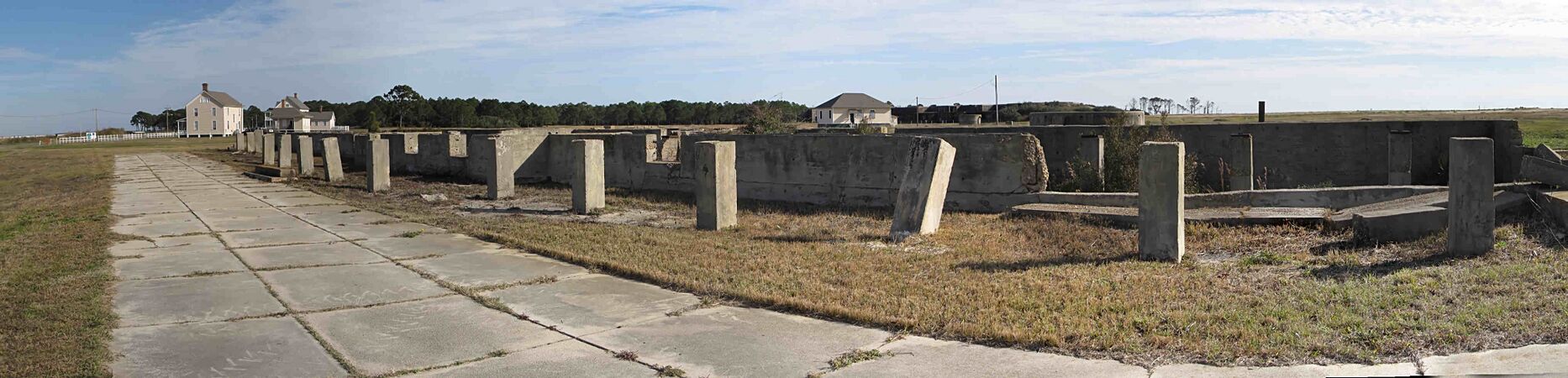 Looking east from the troops' barracks area (the foundation in the foreground was the 39th Company quarters, built in about 1910) in the center distance is the post bakery with Battery Bowyer in the far distance.