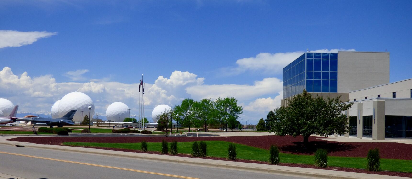 Buckley AFB 140th ABW HQ in 2015. The Geodesic Domes on the left house communications and control equipment for various Space Systems.