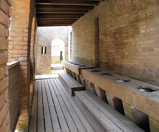 The 10 seat latrine at Fort Gaines, looking north. The doorway is access to the Chemin de Ronde